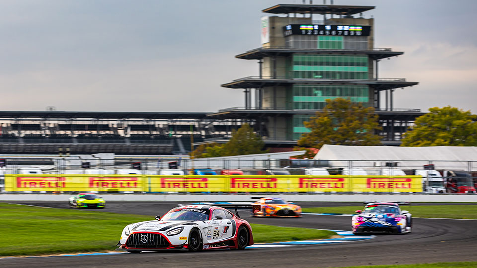 Cars race at the Indianapolis 8 Hour