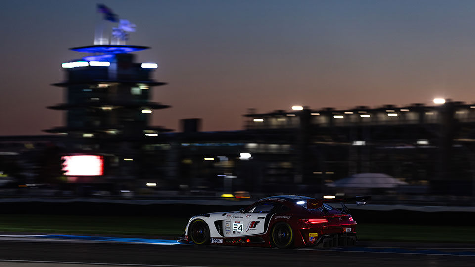a car races at night